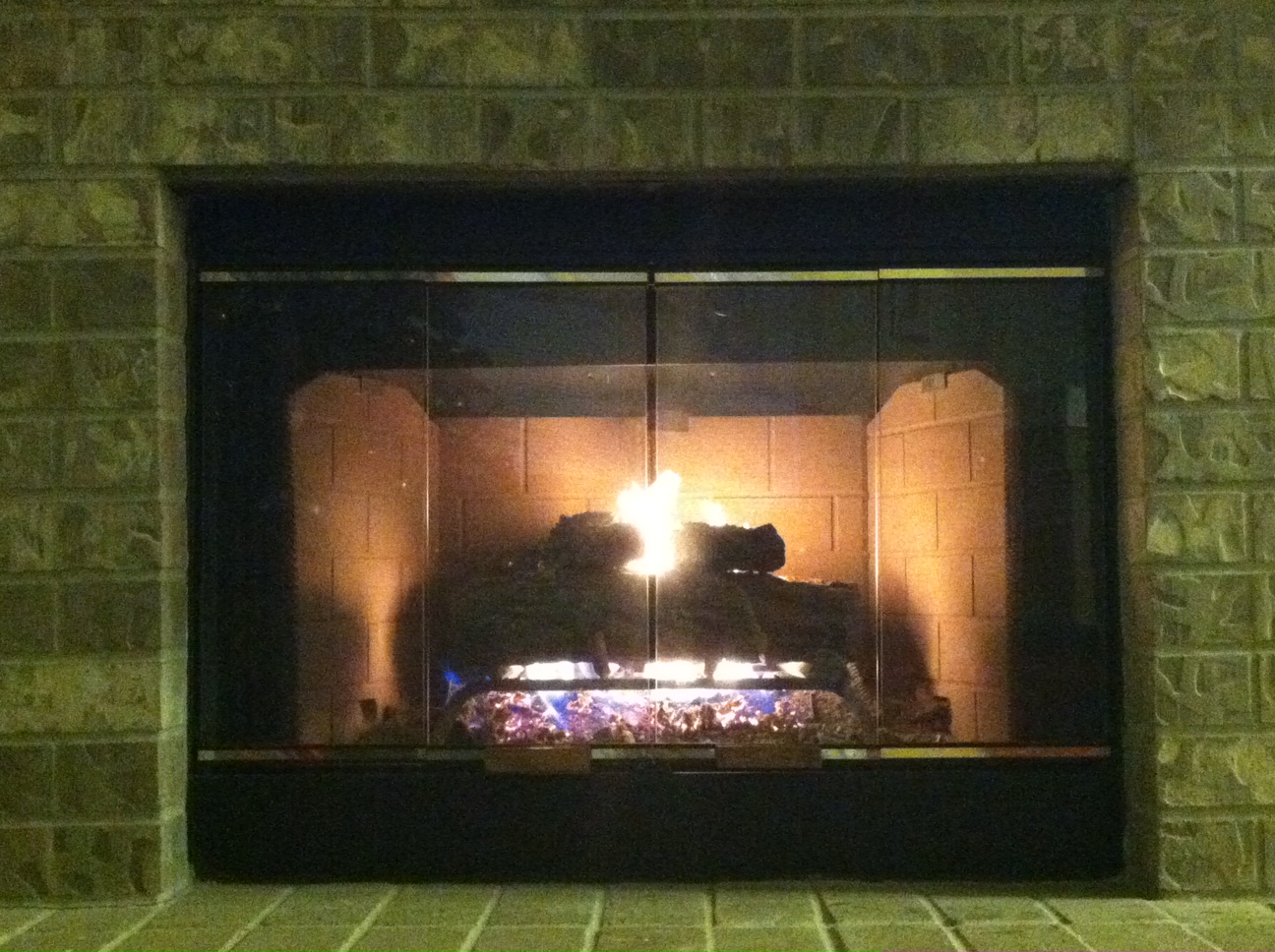 A ventless combustion fireplace has no chimney; it draws combustion air from and releases combustion byproducts to the room in which it is located.
