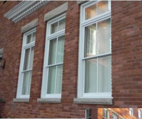 The addition of low-E permanent exterior storm windows is typically accepted for most historic preservation projects