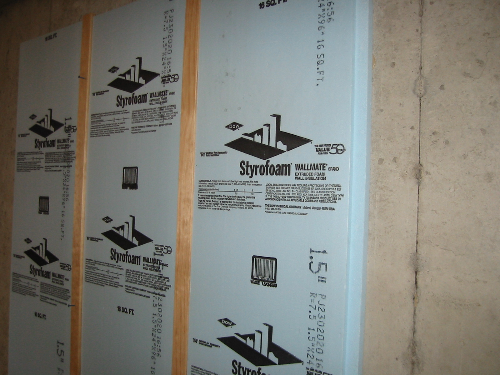Rigid foam insulation is installed directly in contact with the below-grade basement wall. This stops water vapor from passing into the home and also keeps warm and moist interior air from condensing on the cold walls