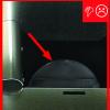 Back-draft damper still has a piece of tape that prevented it from rattling during shipping
