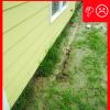 There are no gutters installed and there is not a proper gravel bed located at the foundation
