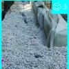 House without gutters has waterproof liner, drain tile, and gravel bed extending more than 5 feet from foundation