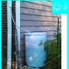 Rain barrel installed with an overflow spout terminating at least 5 feet from foundation