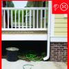 The downspout terminates too close to the foundation of the house