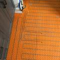 Right – A mat is installed to contain radiant floor loops which distribute hot water from this home’s combi boiler.