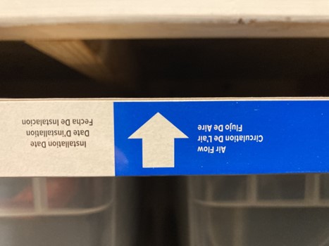 Airflow direction labeled on edge of filter