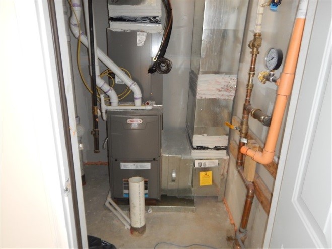All seams in the HVAC equipment and ductwork are sealed with mastic; because the HVAC equipment is in the garage, it is an air-sealed closet.