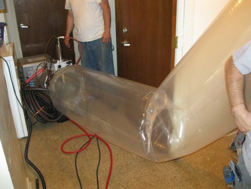 The duct sealing spray injection system application tunnel inflates as the injection system operates.