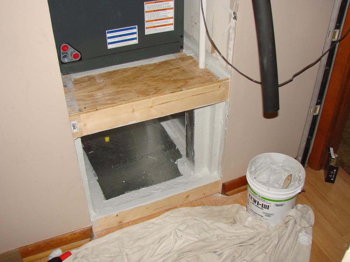 The opening around the grille at the front of the return plenum is well sealed with mastic.