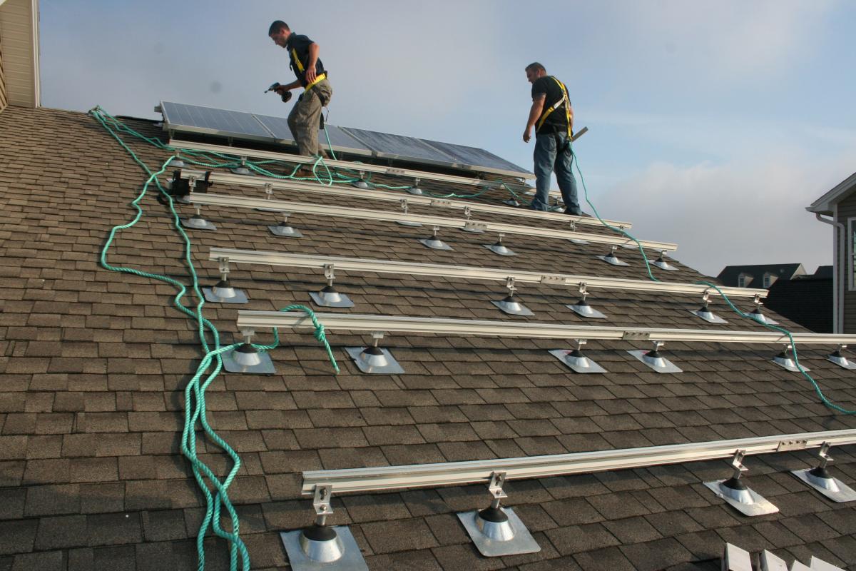 Completion of the first row of PV panels and quality assurance checks.
