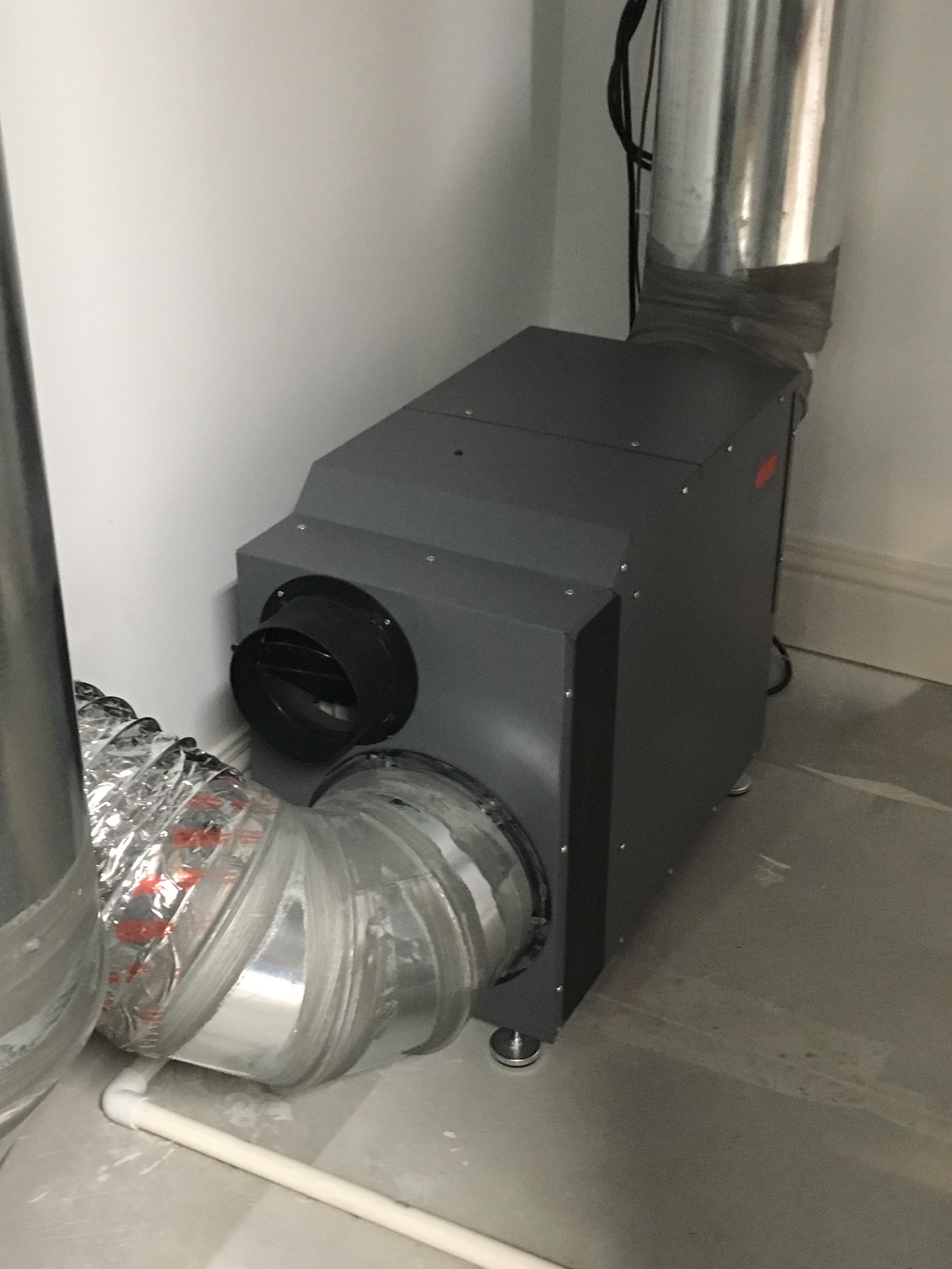 A whole-house dehumidifier is connected to the return side of the HVAC