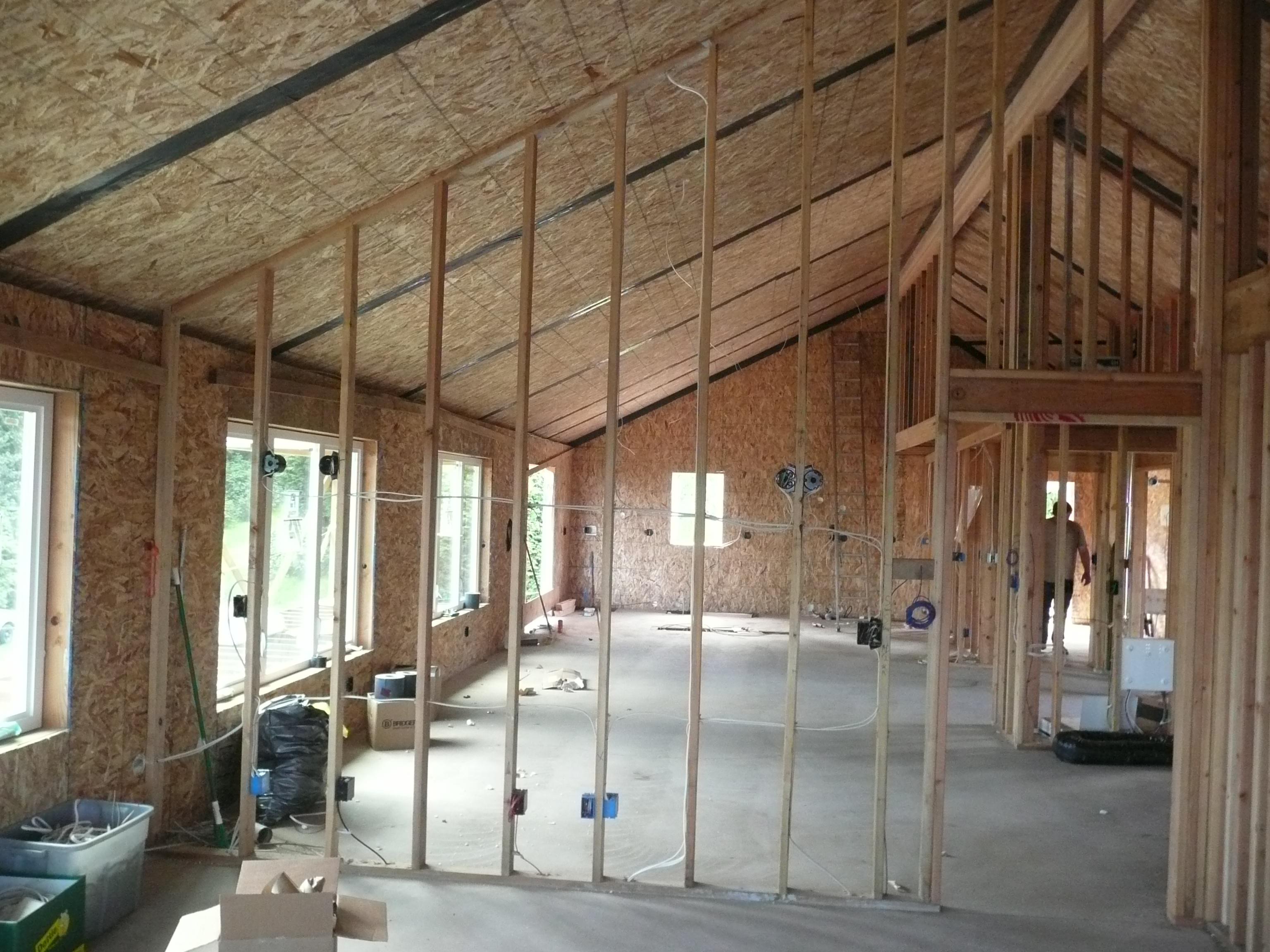 Concrete slabs are used on both the first and second floors of this SIP home to provide passive solar heating from large south-facing windows.