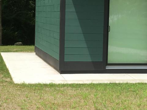 A concrete skirt provides pest resistance at the building perimeter 