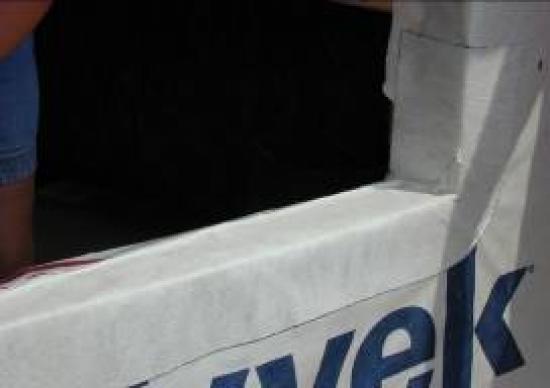 The back dam of the window sill will force water out.