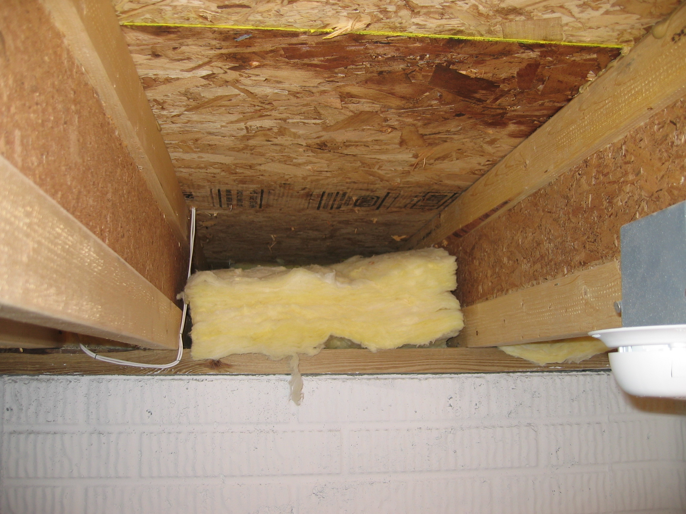 Insulation not aligned with subfloor or joists.