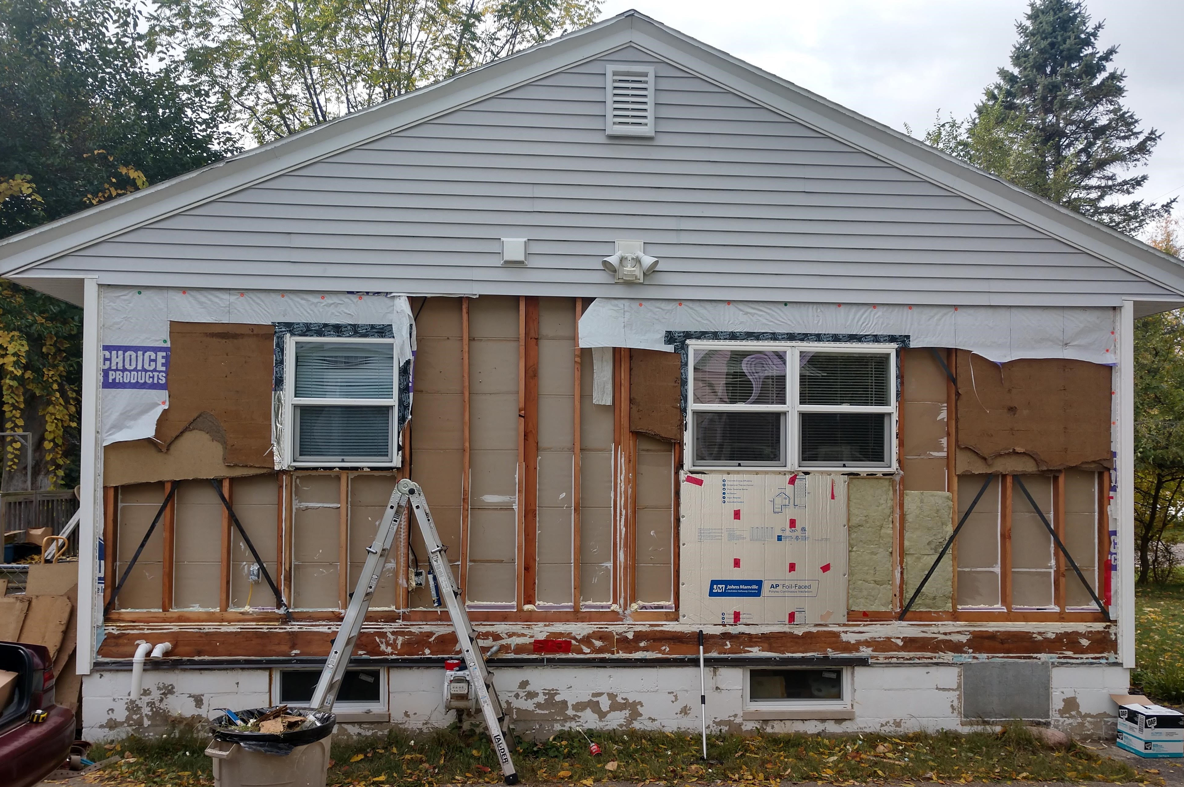 1940s house siding removed caulking wall cavities