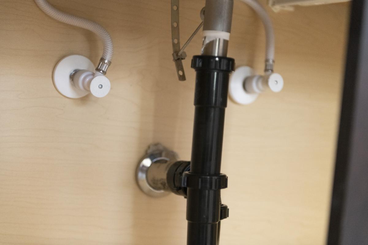 Under-counter piping of bathroom faucet.