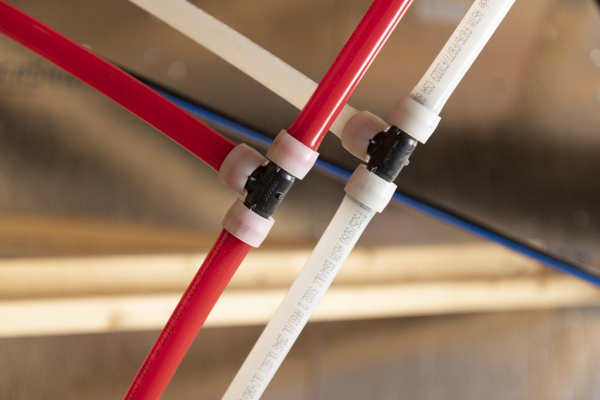 A combination of PEX piping connectors.