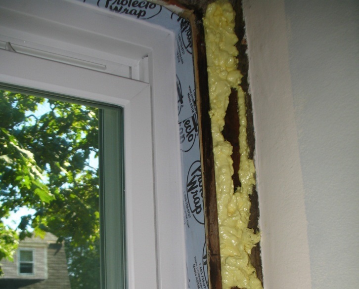Example of membrane installation in a wood window frame.