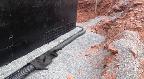 Interior and exterior footing drains keep moisture away from the foundation. Spray-on water proofing helps the concrete foundation walls resist moisture.