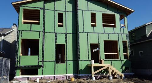 The OSB sheathing is coated and taped at the seams to provide a weather-resistant barrier that can take the place of house wrap.