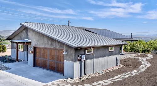 This builder in central Washington state chose durable low-maintenance exterior finishes like metal roofing, and hydrolyzed lime and metal siding. 