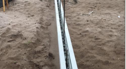 Metal-reinforced rigid foam panels create a form for the concrete foundation walls.