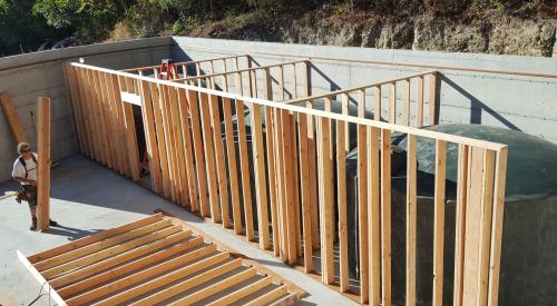 Right – The basement contains four 5,000-gallon rainwater holding tanks for this home which meets all of its water needs with rainwater.
