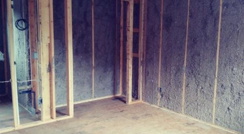 Right – The exterior wall cavities are completely filled with dense-packed cellulose.