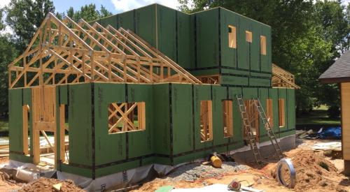 Right – Coated sheathing is taped at all seams to serve as an exterior air barrier on the walls.