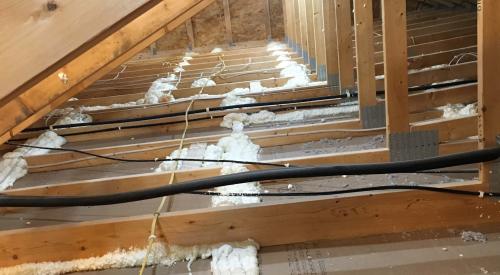 Right – The top plate-to-dry wall seams of the interior walls are sealed from the attic.
