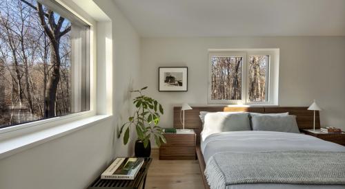 This home’s exterior walls include Larsen trusses, 9-inch I-joists attached through exterior sheathing to wall studs creating a 9-inch wall cavity that was filled with blown insulation and forms extra deep windowsills.