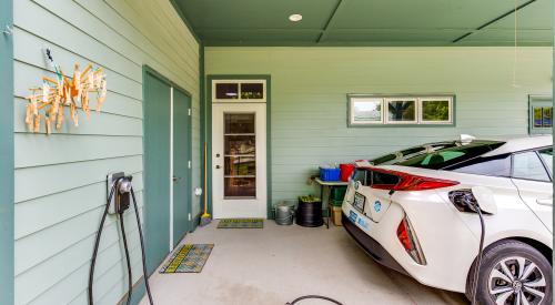Right – This net zero energy home has an electric vehicle charging station in the carport.