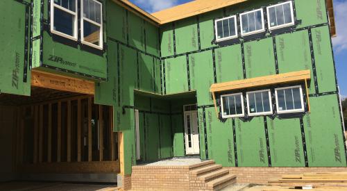 Wrong – the sheathing tape is properly installed to cover all seams in the coated sheathing but the flexible sill flashing product is not consistently installed or fully adhered around the window sills and is missing or lapped at some corners. 