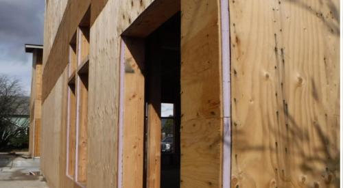 Right – A 1-inch layer of XPS rigid foam covers the 2x6 wall studs and is topped by ½-inch-thick plywood sheathing, which is covered with draining house wrap and serves as a nailing surface for siding and trim.
