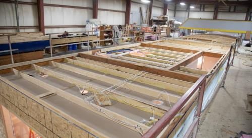 Right – Walls, windows, and wiring are installed in the factory for these modular homes, which are installed at the site on basement foundations made of insulated concrete wall panels.