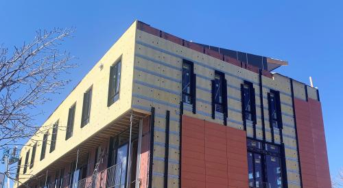 Right – Terra cotta tiles are attached to horizontal metal furring strips as the exterior cladding over mineral wool insulation on this multi-family building in Colorado. 