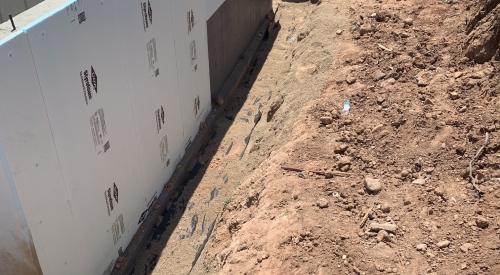 Right - Rigid foam is installed over a waterproofing membrane that has been applied to the basement foundation walls. 