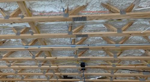Right - The ceiling above the garage is insulated and air-sealed with open-cell spray foam to keep garage fumes out of the living space above. 