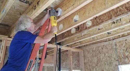 Right – Holes were drilled into the I joists between floors to run the small-diameter HRV ducts.