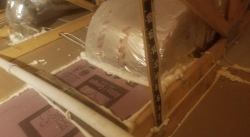 Right – Several potential sources of air leakage into the attic have been air sealed; canned spray foam was used to seal around duct boots, along seams in the drywall, and along top plates. 