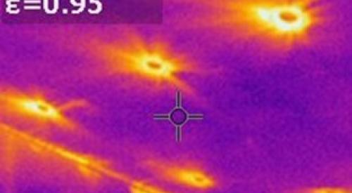 The yellow areas in this infrared camera image show where heat from the attic is entering the home around recessed can light fixtures 