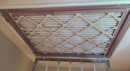 The gap between the air filter and the return duct opening has been sealed with tape that will stop air flow but is easily pulled off or cut through when the filter needs to be replaced.