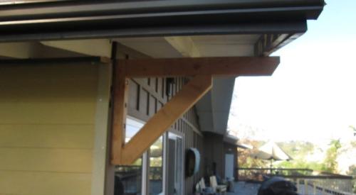 Angle support framing is added to brace a long gable overhang constructed using the ladder framing method.