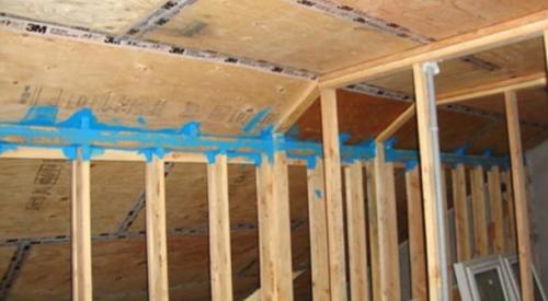 The seams in the plywood are taped seams in the cathedral ceiling serve as part of the advanced home sealing strategy.
