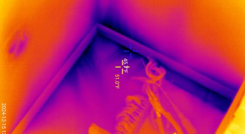 This infrared image shows cold air entering the home through leaks in the sill plate 