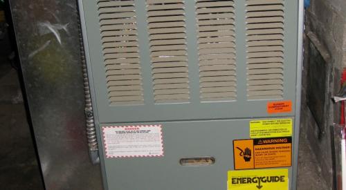 Older gas furnaces like this one do not have sealed combustion or fan-assisted sealed exhaust ducts; they draw their combustion air from the space they are located in and rely on a hot flue to carry exhaust emissions up and out the flue pipe. 