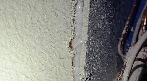 Caulk was used here to air seal the gap between the electrical box and the drywall.