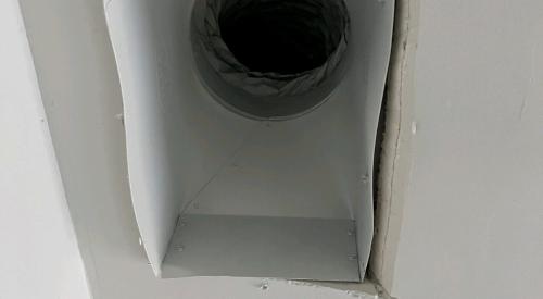 With the register grill removed, very large gaps are visible around the edges of this duct boot between the duct boot and the drywall; the gaps can be closed with screw or heavy staples then sealed with caulk, mastic, or metal tape.