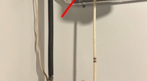 The valve for the cold-water inlet pipe is a lever-style valve located up high; if there's an expansion tank, it is connected to the cold water line and the valve is typically upstream of the expansion tank (connected here by white horizontal pipe).